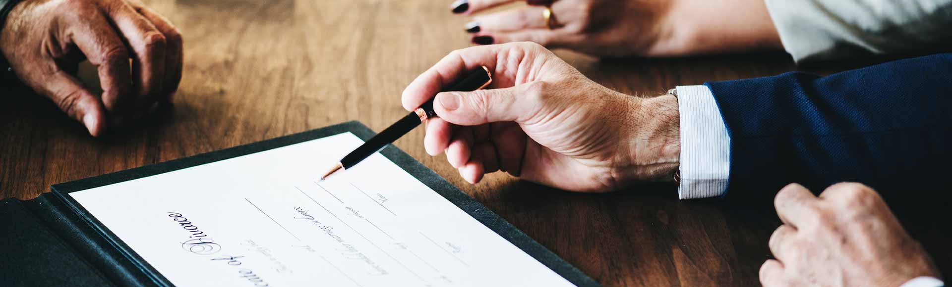 Living trust attorney reviewing trust documents with San Luis Obispo 93401 family